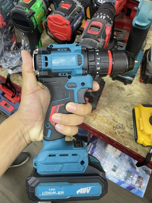 Аккумуляторная дрель-шуруповерт бирюзового цвета с черными и красными Bishkek - photo 1