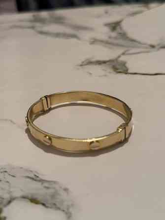 Браслет Картиэр 
Жёлтый золото 585
За грамм 8500сом
Срочно продам Бишкек